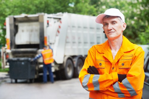 Front of a waste collection vehicle parked outside commercial premises
